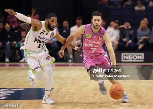 Will McDowell-White of the New Zealand Breakers drives past Gary Browne of the South East Melbourne Phoenix during the round nine NBL match between...