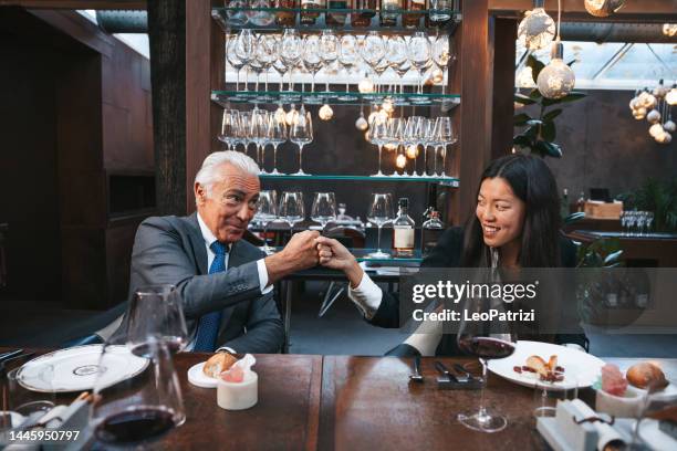 business agreement during meeting at lunch - meal deal stock pictures, royalty-free photos & images