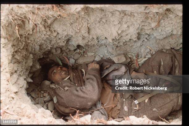 Dead Afghan government soldier lies on the ground March 8, 1989 in Jalalabad, Afghanistan. The end of Soviet military occupation, which began in...
