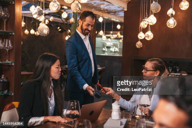 businesswoman paying job lunch using contactless mobile app payment - chinese waiter stock pictures, royalty-free photos & images