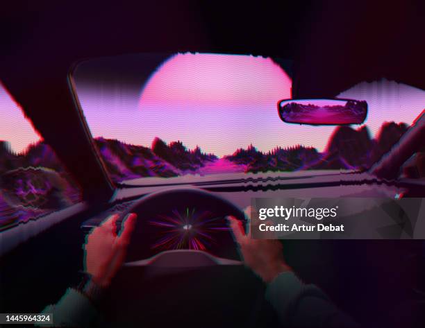 driving a futuristic car in surreal cyber landscape in the metaverse with glitch effect and big sun. pov. - augmented reality car stockfoto's en -beelden