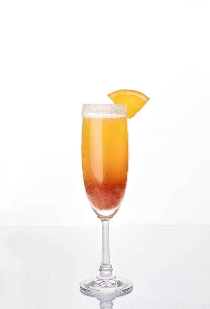 sunrise strawberry mimosa cocktail - orange cocktail stock pictures, royalty-free photos & images