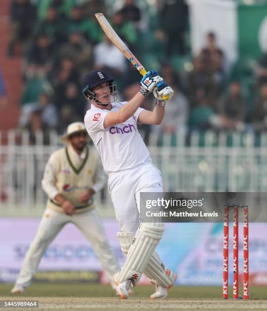 Harry Brook of England hits out for six runs during the First Test Match between Pakistan and England at Rawalpindi Cricket Stadium on December 01,...