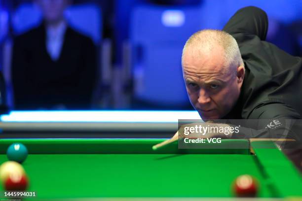 John Higgins of Scotland plays a shot during the first round match against Cao Yupeng of China on day three of the 2022 BetVictor Scottish Open at...