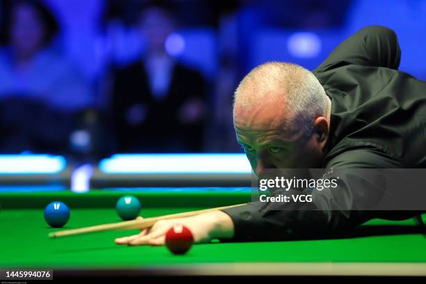 John Higgins of Scotland plays a shot during the first round match against Cao Yupeng of China on day three of the 2022 BetVictor Scottish Open at...