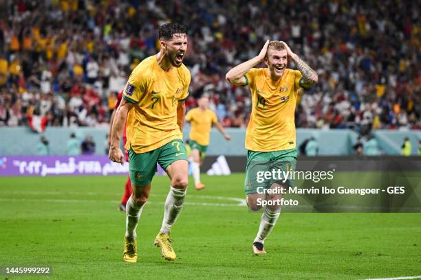 Mathew Leckie celebrates with Riley McGree of Australia after scoring his team's first goal during the FIFA World Cup Qatar 2022 Group D match...