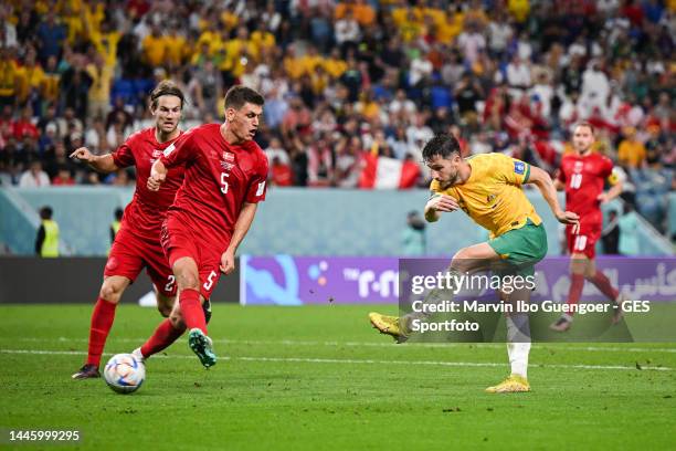 Mathew Leckie of Australia scores his team's first goal against Joachim Andersen and Joakim Maehle of Denmark during the FIFA World Cup Qatar 2022...