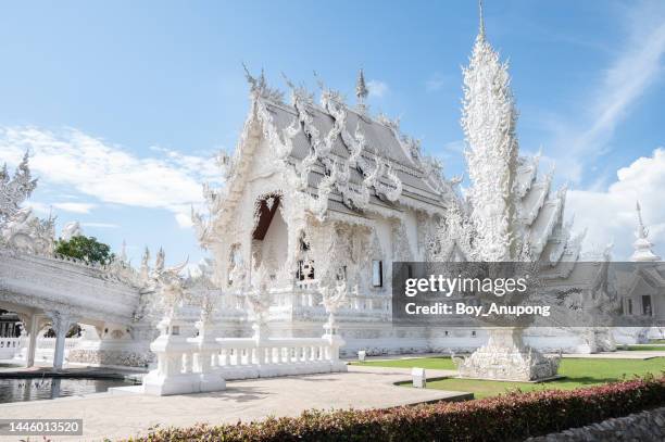 beautiful architecture of wat rong khun (the white temple) one of the most tourist attraction in chiang rai province of thailand. - chiang rai province stock pictures, royalty-free photos & images