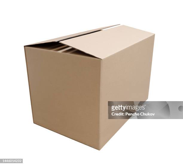 closed rectangular cardboard box made of corrugated cardboard - big brown stock pictures, royalty-free photos & images