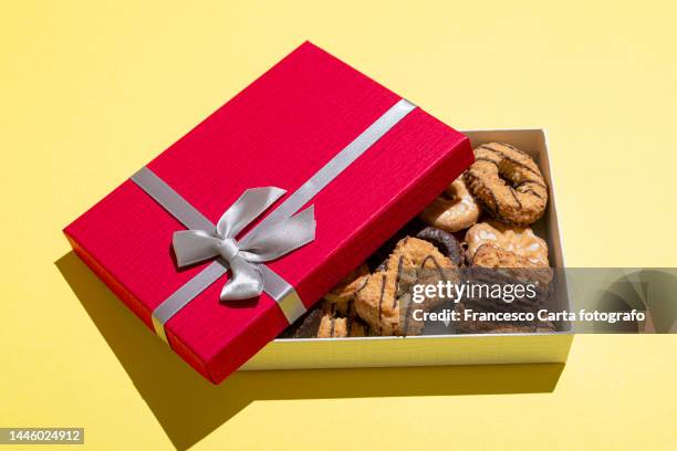 assorted biscuits inside open red gift box - close up of chocolates for sale stock pictures, royalty-free photos & images