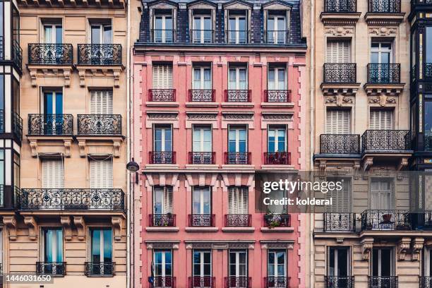 full frame of old row houses exteriors in paris - balcony window stock pictures, royalty-free photos & images