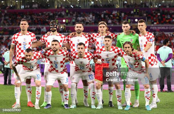 Croatia players line up for team photos prior to the FIFA World Cup Qatar 2022 Group F match between Croatia and Belgium at Ahmad Bin Ali Stadium on...