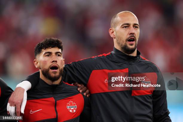 Jonathan Osorio and Milan Borjan of Canada sing the national anthem prior to the FIFA World Cup Qatar 2022 Group F match between Canada and Morocco...