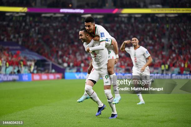 Hakim Ziyech of Morocco celebrates with teammate Azzedine Ounahi after scoring the team's first goal during the FIFA World Cup Qatar 2022 Group F...