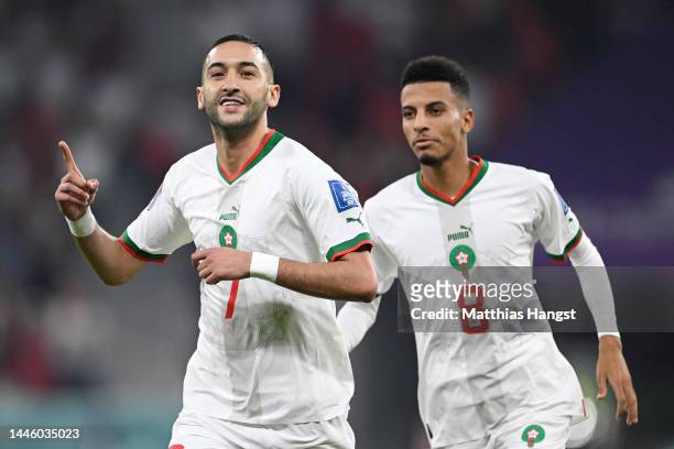 Hakim Ziyech of Morocco celebrates with Azzedine Ounahi after scoring the team's first goal during the FIFA World Cup Qatar 2022 Group F match...
