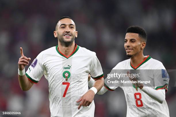 Hakim Ziyech of Morocco celebrates with Azzedine Ounahi after scoring the team's first goal during the FIFA World Cup Qatar 2022 Group F match...