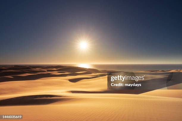 sunset at sandwich harbour, namibia - walvis bay stock pictures, royalty-free photos & images