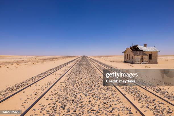 railway in the sand in namibia - kolmanskop namibia photos et images de collection
