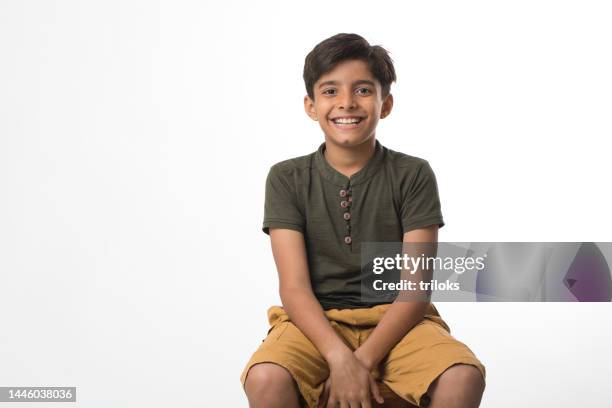 portrait of confident boy at studio - indian boy portrait stockfoto's en -beelden