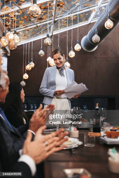 businesswoman taking a speech at the corporate lunch - dining presentation food stock pictures, royalty-free photos & images