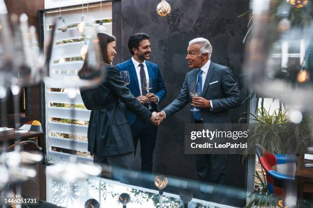 business agreement handshake - fundraising stock pictures, royalty-free photos & images