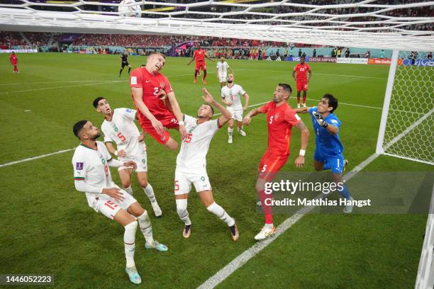 Alistair Johnston of Canada attempts to head the ball after the ball drops on the goal line after the header of Atiba Hutchinson during the FIFA...