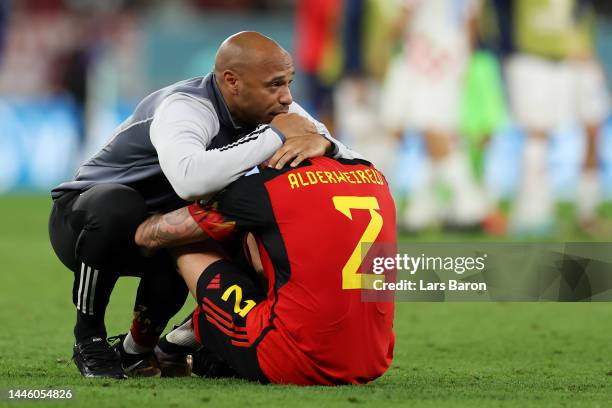 Thierry Henry, Assistant Coach of Belgium consoles Toby Alderweireld of Belgium after their sides' elimination from the tournament during the FIFA...