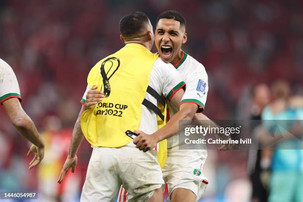 Abdelhamid Sabiri and Hakim Ziyech of Morocco celebrate their 2-1 victory and gone through to the knock out stage as top of the group after the FIFA...