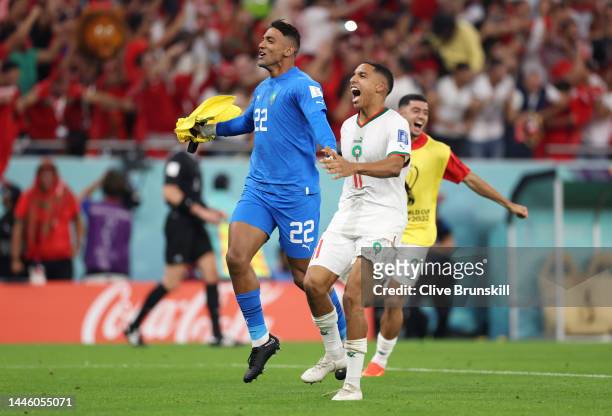 Reda Tagnaouti and Abdelhamid Sabiri of Morocco celebrate after the team's qualification to the knockout stages during the FIFA World Cup Qatar 2022...