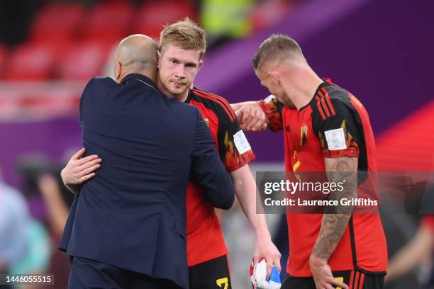 Roberto Martinez, Kevin De Bruyne and Toby Alderweireld of Belgium look dejected after their sides' elimination from the tournament during the FIFA...