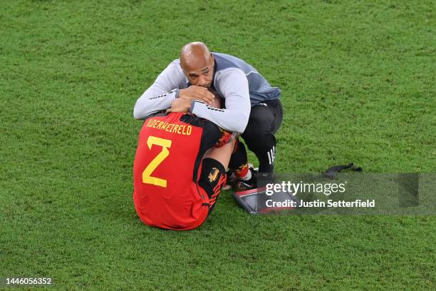 Thierry Henry, Assistant Coach of Belgium consoles Toby Alderweireld of Belgium after their sides' elimination from the tournament during the FIFA...