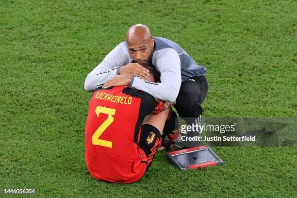 Thierry Henry, Assistant Coach of Belgium consoles Toby Alderweireld of Belgium after their sides' elimination from the tournament during the FIFA...