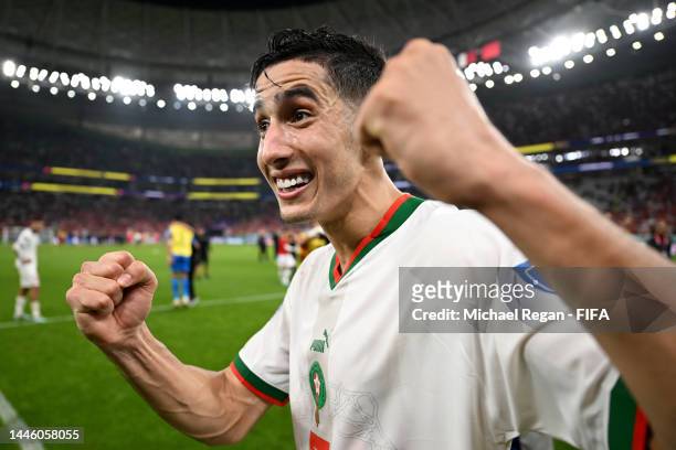 Nayef Aguerd of Morocco celebrates after the team's qualification to the knockout stages during the FIFA World Cup Qatar 2022 Group F match between...