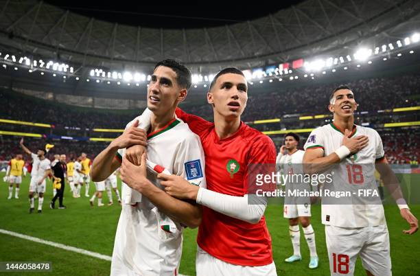 Nayef Aguerd and Bilal El Khannouss of Morocco celebrate after the team's qualification to the knockout stages during the FIFA World Cup Qatar 2022...