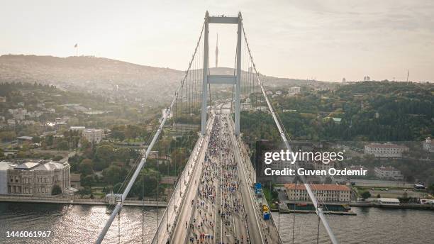 aerial view of the world's only intercontinental running marathon, city marathon, athletes running, aerial view of people running in the middle of the city, aerial view of marathon runners, runners, istanbul runner marathon - bosphorus stock pictures, royalty-free photos & images