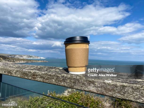 plain disposable paper coffee cup with coastal view - disposal container stock pictures, royalty-free photos & images