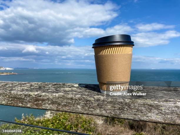 plain disposable paper coffee cup with coastal view - disposal container stock pictures, royalty-free photos & images