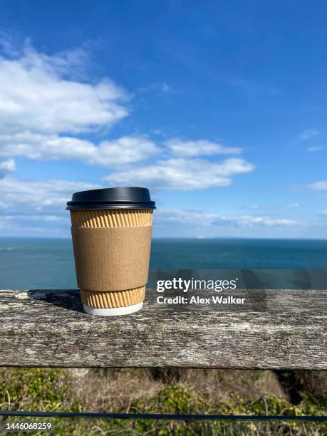 plain disposable paper coffee cup with coastal view - disposal container stock pictures, royalty-free photos & images