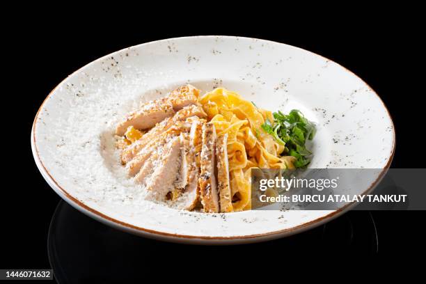 grilled chicken tagliatelle alfredo - fettuccine alfredo stock pictures, royalty-free photos & images