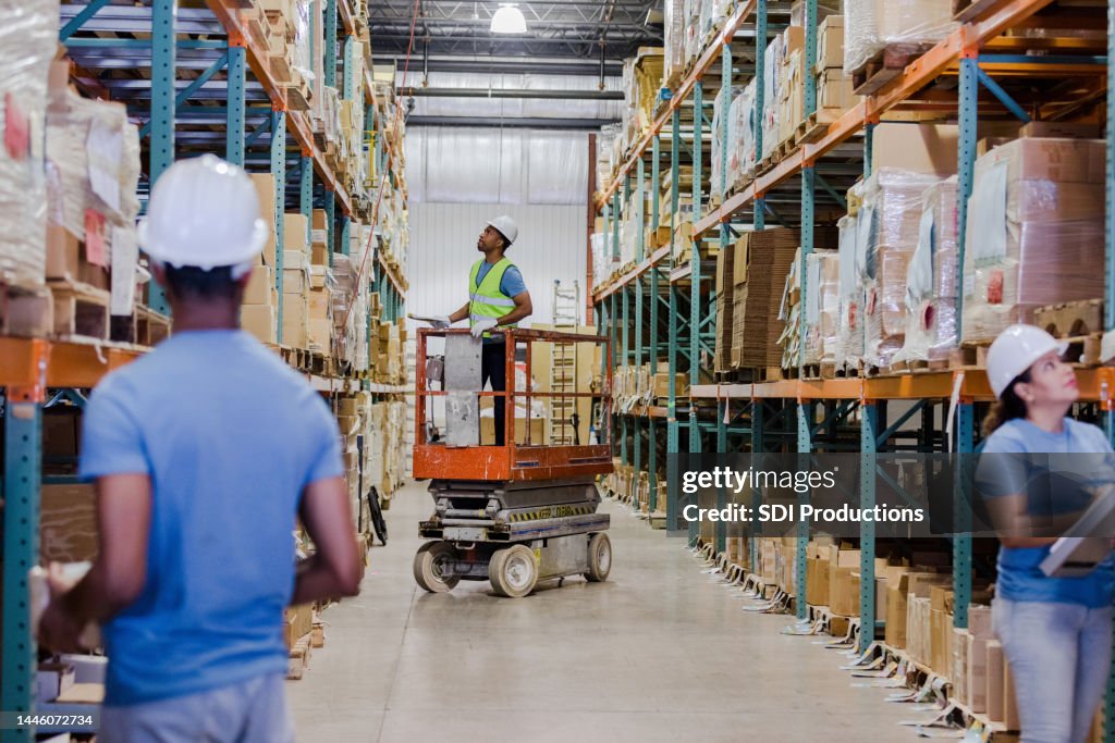 Warehouse employees working together