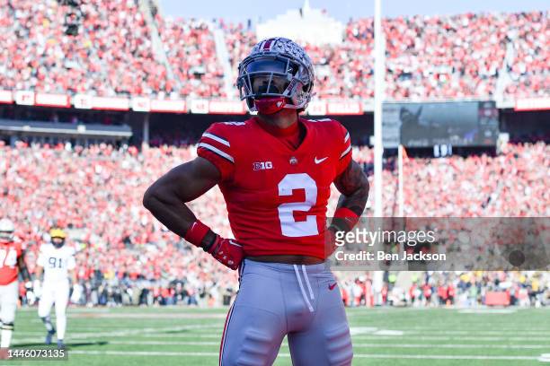 Emeka Egbuka of the Ohio State Buckeyes poses after scoring a touchdown during the first quarter of a game against the Michigan Wolverines at Ohio...