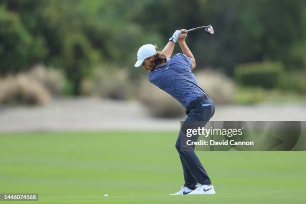 Tommy Fleetwood of England plays his second shot on the third hole during the first round of the 2022 Hero World Challenge at Albany Golf Course on...