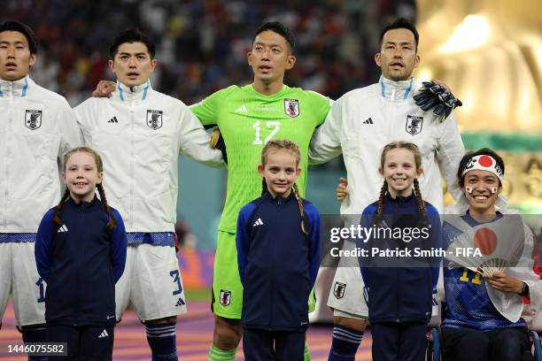 Japan players line up for the national anthem prior to the FIFA World Cup Qatar 2022 Group E match between Japan and Spain at Khalifa International...