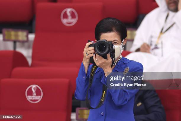 Japan's Princess Hisako of Takamado takes photographs prior to the FIFA World Cup Qatar 2022 Group E match between Japan and Spain at Khalifa...