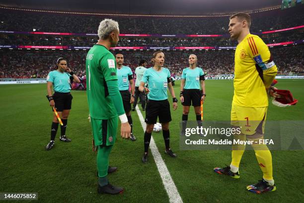 Keylor Navas of Costa Rica and Manuel Neuer of Germany look on as referee Stephanie Frappart prepares for the coin toss prior to the FIFA World Cup...