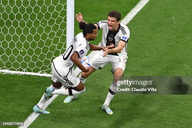 Serge Gnabry celebrates with Thomas Mueller of Germany after scoring the team's first goal during the FIFA World Cup Qatar 2022 Group E match between...