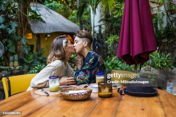 lovely couple kissing - lesbians kissing stock pictures, royalty-free photos & images