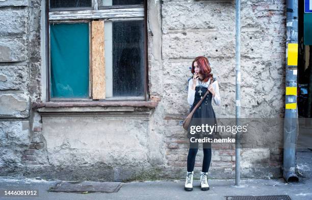 teenager smoking on a sidewalk - anti smoking bildbanksfoton och bilder