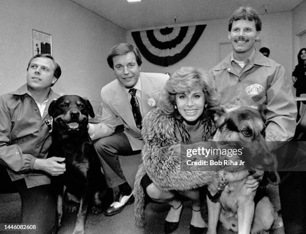 Hart to Hart' television show stars Stefanie Powers and Robert Wagner stopped to pet security canines and pose for photos as they attended a charity...