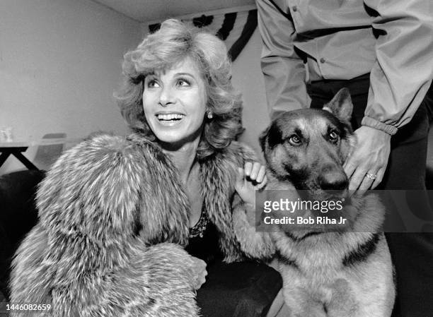 Hart to Hart' television show star Stefanie Powers stopped to pet security canines and pose for photos as she attended a charity event onboard the...